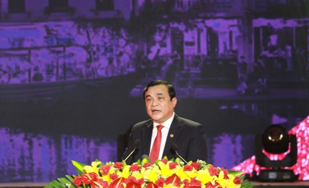 A person in a suit and tie at a podium with microphonesDescription automatically generated with low confidence